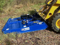 Thumbnail for The image shows a blue mower attached to a yellow tractor driving through a field of tall grass. 
