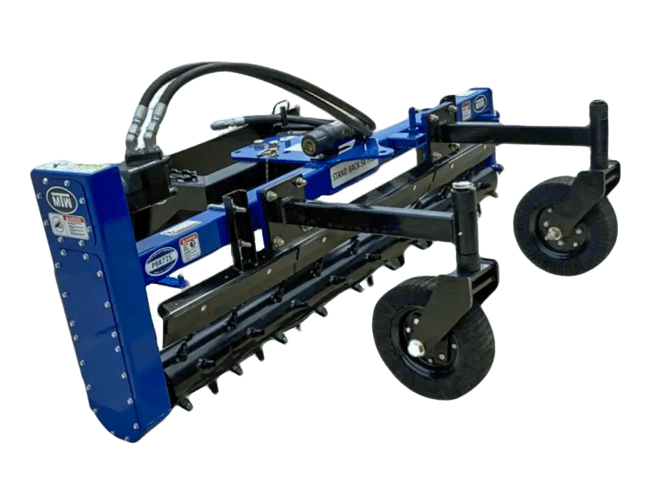 A heavy-duty power rake - professional attached to a tractor, used for breaking up and leveling soil.