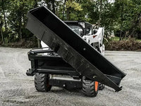 Thumbnail for The image shows a large bucket attached to a skid steer loader. The skid steer is parked on a gravel road, and the bucket is tilted to the side. The skid steer is yellow and black, and the bucket is black.