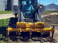 Thumbnail for A 3D model of a ground ripper attachment with four curved, sharp teeth, colored in gray on a white background.