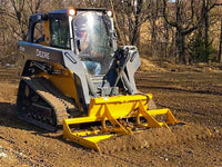 Thumbnail for A skid steer loader with a land leveler attachment is used to level a dirt field.