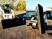 Thumbnail for A skid steer with the black rectangular bucket sitting on top of a gravel road. 