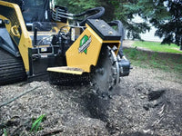 Thumbnail for A photo of a stump grinder clearing a field of stumps, before new construction can begin